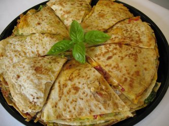 Individual vegetable quesadillas served with salsa or guacamole
